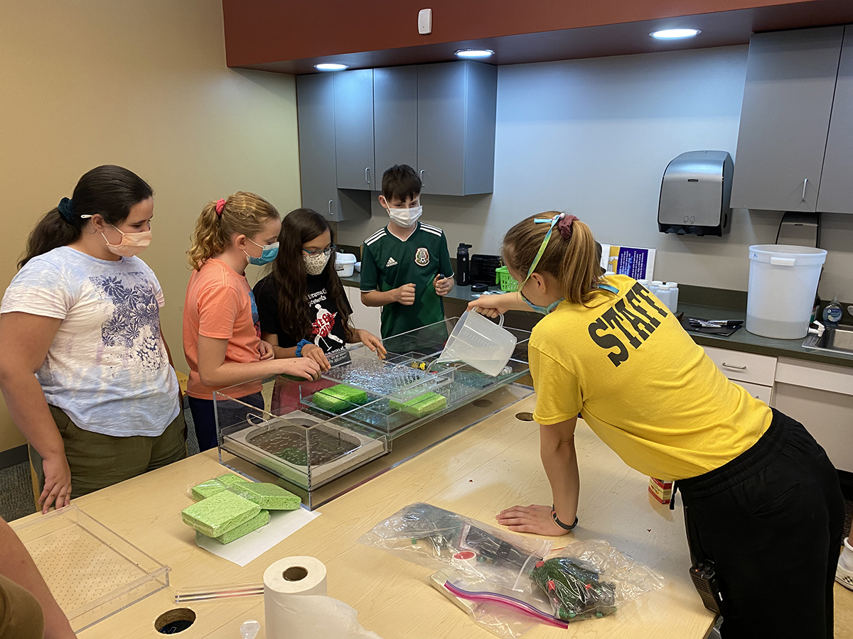 photo: CWE staff demonstrating reverse osmosis to students