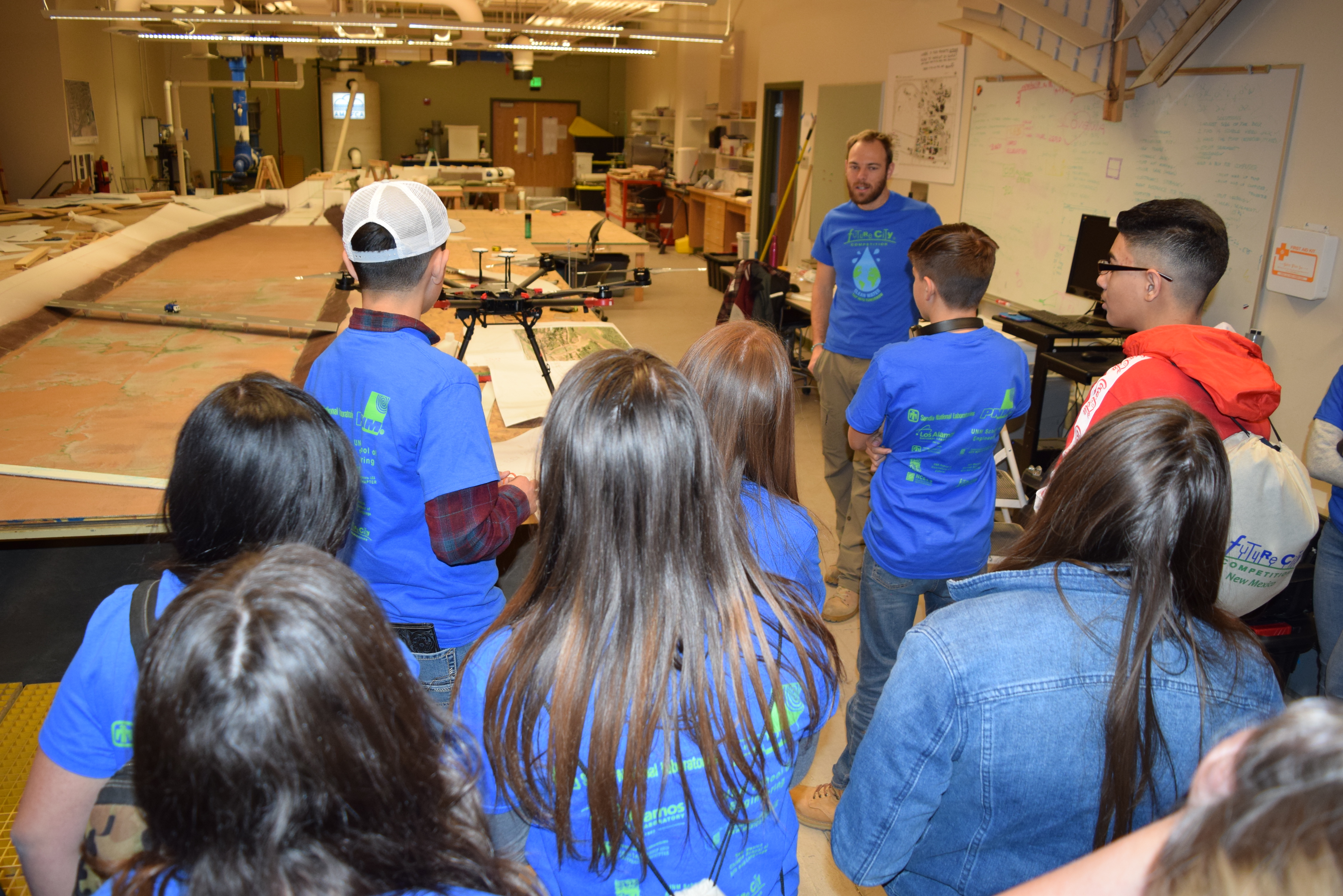 photo: A group of people being led on a tour of a laboratory